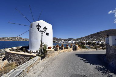 Paros, Greece - September 17, 2024: Old windmill now used as a cafe and bar in the town of Parikia clipart