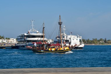 Cos, Greece - September 04, 2025: Unidentified people on colorful ship for traveling to other islands