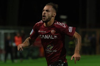 Canotto Luigi Reggina, İtalya 'nın Reggio Calabria şehrindeki Oreste Granillo Stadyumu' nda 1914-1914 yılları arasında oynanan İtalyan Serie B karşılaşmasında gol 1-0 'lık galibiyetini kutluyor.
