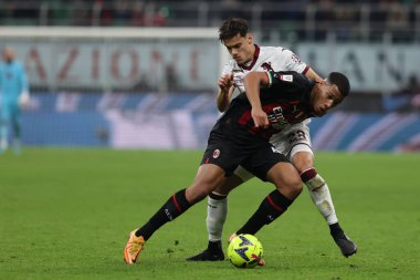 Aster Vranckx of AC Milan competes for the ball with Samuele Ricci of Torino FC during Coppa Italia 2022/23 football match between AC Milan and Torino FC at San Siro Stadium, Milan, Italy on January 11, 2023 - Credit: Fabrizio Carabelli/LiveMedi