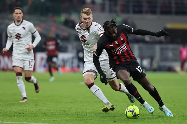 Rafael Leao of AC Milan competes for the ball with Perr Schuurs of Torino FC during Coppa Italia 2022/23 football match between AC Milan and Torino FC at San Siro Stadium, Milan, Italy on January 11, 2023 - Credit: Fabrizio Carabelli/LiveMedi