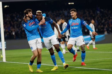 Victor Osimhen of Napoli celebrates after scores with Khvicha Kvaratskhelia of Napoli and Giovanni Di Lorenzo of Napoli  during italian soccer Serie A match SSC Napoli vs Juventus FC at the Diego Armando Maradona stadium in Naples, Italy, January 13,