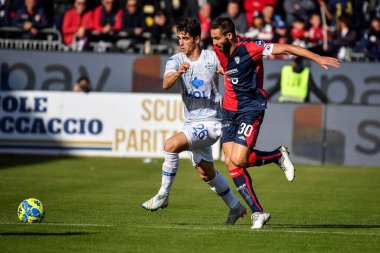 Leonardo Pavoletti of Cagliari Calcio, Cas Odenthal of Como 1907 during Italian soccer Serie B match Cagliari Calcio vs Como 1907 at the Unipol Domus in Cagliari, Italy, January 14, 2023 - Credit: Luigi Can