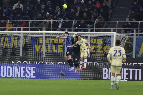 Andre Onana of FC Internazionale competes for the ball with Kevin Lasagna of Hellas Verona FC and Alessandro Bastoni of FC Internazionale during Serie A 2022/23 football match between FC Internazionale and Hellas Verona FC at Giuseppe Meazza Stadium,