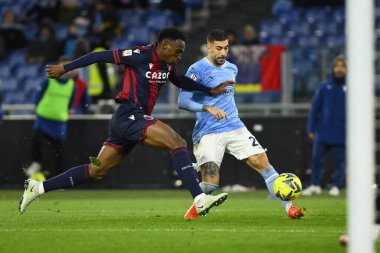 Mattia Zaccagni of S.S. LAZIO and Jhon Lucumi of Bologna F.C. during the Coppa Italia eighth of finals between S.S. Lazio vs Bologna F.C. on January 19, 2023 at the Stadio Olimpico, Rome, Italy. - Credit: Domenico Cippitelli/LiveMedi