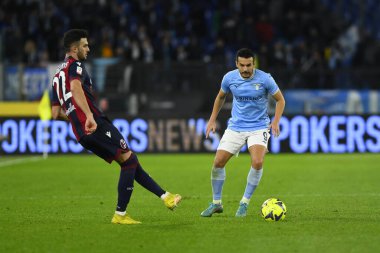 Charalampos Lykogiannis of Bologna F.C. and Pedro of S.S. LAZIO during the Coppa Italia eighth of finals between S.S. Lazio vs Bologna F.C. on January 19, 2023 at the Stadio Olimpico, Rome, Italy. - Credit: Domenico Cippitelli/LiveMedi