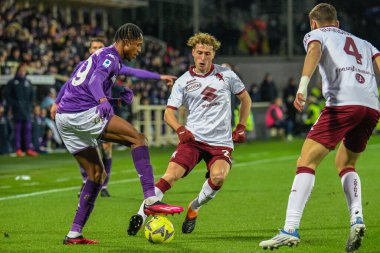 Fiorentina's Christian Kouame fights for the ball against Torino's Mergin Vojvoda during italian soccer Serie A match ACF Fiorentina vs Torino FC at the Artemio Franchi stadium in Florence, Italy, January 21, 2023 - Credit: Fabio Fagiolin