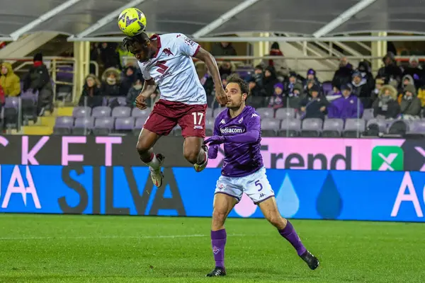 header of Torino's Singo Wilfried against Fiorentina's Giacomo Bonaventura during italian soccer Serie A match ACF Fiorentina vs Torino FC at the Artemio Franchi stadium in Florence, Italy, January 21, 2023 - Credit: Fabio Fagiolin