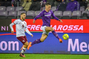 Fiorentina's Nikola Milenkovic fights for the ball against Torino's Nikola Vlasic during italian soccer Serie A match ACF Fiorentina vs Torino FC at the Artemio Franchi stadium in Florence, Italy, January 21, 2023 - Credit: Fabio Fagiolin