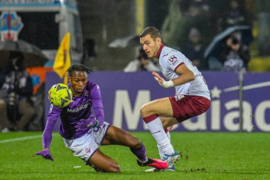 Fiorentina's Christian Kouame is fouled by Torino's Alessandro Buongiorno during italian soccer Serie A match ACF Fiorentina vs Torino FC at the Artemio Franchi stadium in Florence, Italy, January 21, 2023 - Credit: Fabio Fagiolin