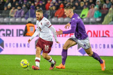 Torino's Nikola Vlasic fights for the ball against Fiorentina's Nikola Milenkovic during italian soccer Serie A match ACF Fiorentina vs Torino FC at the Artemio Franchi stadium in Florence, Italy, January 21, 2023 - Credit: Fabio Fagiolin