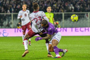Torino's Demba Seck fights for the ball against Fiorentina's Igor during italian soccer Serie A match ACF Fiorentina vs Torino FC at the Artemio Franchi stadium in Florence, Italy, January 21, 2023 - Credit: Fabio Fagiolin