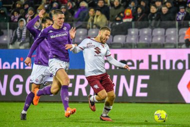 Torino's Nikola Vlasic hampered by Fiorentina's Nikola Milenkovic during italian soccer Serie A match ACF Fiorentina vs Torino FC at the Artemio Franchi stadium in Florence, Italy, January 21, 2023 - Credit: Fabio Fagiolin