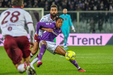 Fiorentina's Christian Kouame hampered by Torino's Koffi Djidji during italian soccer Serie A match ACF Fiorentina vs Torino FC at the Artemio Franchi stadium in Florence, Italy, January 21, 2023 - Credit: Fabio Fagiolin