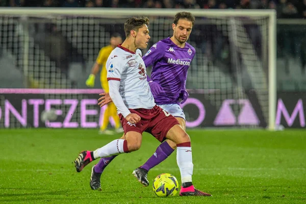 Torino's Samuele Ricci fights for the ball against Fiorentina's Giacomo Bonaventura during italian soccer Serie A match ACF Fiorentina vs Torino FC at the Artemio Franchi stadium in Florence, Italy, January 21, 2023 - Credit: Fabio Fagiolin