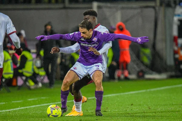 Fiorentina's Giacomo Bonaventura thwarted by Torino's Michel Adopo during italian soccer Serie A match ACF Fiorentina vs Torino FC at the Artemio Franchi stadium in Florence, Italy, January 21, 2023 - Credit: Fabio Fagiolin