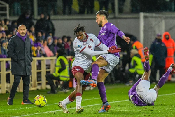 Torino's Singo Wilfried thwarted by Fiorentina's Nicolas Gonzalez during italian soccer Serie A match ACF Fiorentina vs Torino FC at the Artemio Franchi stadium in Florence, Italy, January 21, 2023 - Credit: Fabio Fagiolin