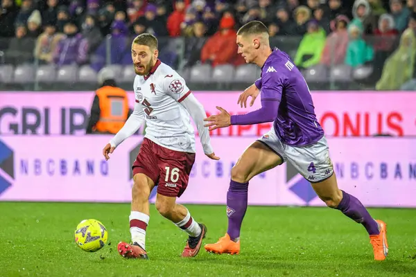 Torino's Nikola Vlasic fights for the ball against Fiorentina's Nikola Milenkovic during italian soccer Serie A match ACF Fiorentina vs Torino FC at the Artemio Franchi stadium in Florence, Italy, January 21, 2023 - Credit: Fabio Fagiolin