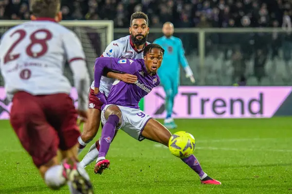 Fiorentina's Christian Kouame hampered by Torino's Koffi Djidji during italian soccer Serie A match ACF Fiorentina vs Torino FC at the Artemio Franchi stadium in Florence, Italy, January 21, 2023 - Credit: Fabio Fagiolin