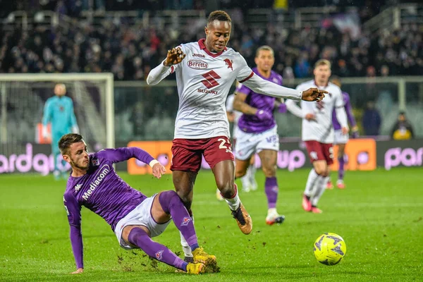 Torino's Demba Seck thwarted by Fiorentina's Aleksa Terzic during italian soccer Serie A match ACF Fiorentina vs Torino FC at the Artemio Franchi stadium in Florence, Italy, January 21, 2023 - Credit: Fabio Fagiolin