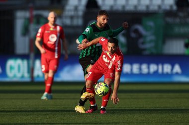Gianluca Caprari of AC Monza is challenged by Domenico Berardi of Sassuolo Calcio  during italian soccer Serie A match AC Monza vs US Sassuolo at the U-Power Stadium in Monza, Italy, January 22, 2023 - Credit: Francesco Scaccianoc