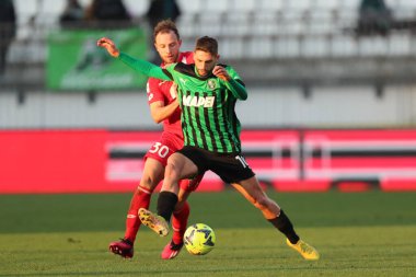 Domenico Berardi of US Sassuolo Calcio competes for the ball with Carlos Augusto of AC Monza during the Serie A match between AC Monza and US Sassuolo Calcio at Stadio Brianteo on January 22, 2023 in Monza, Italy. - Credit: Luca Amedeo Bizzarri/LiveM