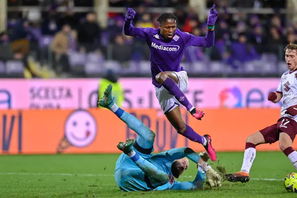 Vanja Milinkovic-Savic (Torino FC) saves on Christian Kouame (ACF Fiorentina) during italian soccer Serie A match ACF Fiorentina vs Torino FC at the Artemio Franchi stadium in Florence, Italy, January 21, 2023 - Credit: Lisa Guglielm