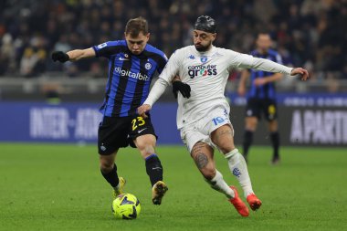 Nicolo Barella of FC Internazionale competes for the ball with Francesco Caputo of Empoli FC during Serie A 2022/23 football match between FC Internazionale and Empoli FC at Giuseppe Meazza Stadium, Milan, Italy on January 23, 2023 - Credit: Fabrizio