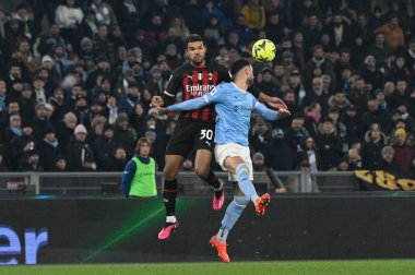 Junior Messias (AC Milan) Elseid Hysaj (SS Lazio) during the Italian Football Championship League A 2022/2023 match between SS Lazio vs AC Milan at the Olimpic Stadium in Rome on 24 January 2023. - Credit: Fabrizio Corradetti/LiveMedi