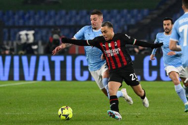 Sergej Milinkovic-Savic (SS Lazio) Sergino Dest (AC Milan)  during the Italian Football Championship League A 2022/2023 match between SS Lazio vs AC Milan at the Olimpic Stadium in Rome on 24 January 2023. - Credit: Fabrizio Corradetti/LiveMedi