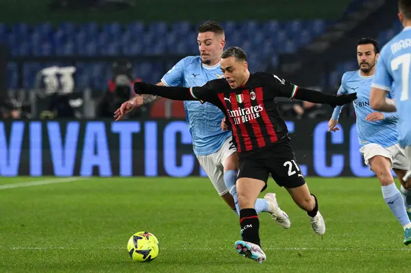 Sergej Milinkovic-Savic (SS Lazio) Sergino Dest (AC Milan)  during the Italian Football Championship League A 2022/2023 match between SS Lazio vs AC Milan at the Olimpic Stadium in Rome on 24 January 2023. - Credit: Fabrizio Corradetti/LiveMedi