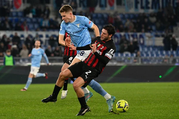 Davide Calabria (AC Milan) Toma Basic (SS Lazio) during the Italian Football Championship League A 2022/2023 match between SS Lazio vs AC Milan at the Olimpic Stadium in Rome on 24 January 2023. - Credit: Fabrizio Corradetti/LiveMedi