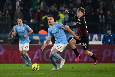 Sergej Milinkovic-Savic (SS Lazio) Alexis Saelemaekers (AC Milan) during the Italian Football Championship League A 2022/2023 match between SS Lazio vs AC Milan at the Olimpic Stadium in Rome on 24 January 2023. - Credit: Fabrizio Corradetti/LiveMedi