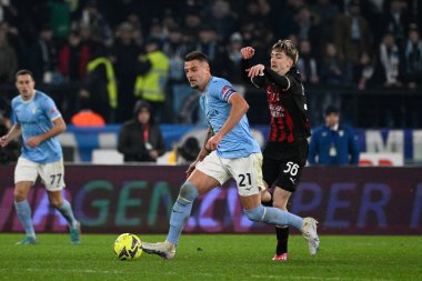 Sergej Milinkovic-Savic (SS Lazio) Alexis Saelemaekers (AC Milan) during the Italian Football Championship League A 2022/2023 match between SS Lazio vs AC Milan at the Olimpic Stadium in Rome on 24 January 2023. - Credit: Fabrizio Corradetti/LiveMedi