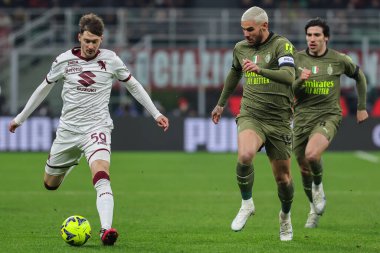 Aleksej Miranchuk of Torino FC and Theo Hernandez of AC Milan in action during Serie A 2022/23 football match between AC Milan and Torino FC at San Siro Stadium, Milan, Italy on February 10, 2023 - Credit: Fabrizio Carabelli/LiveMedi