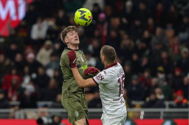 Alexis Saelemaekers of AC Milan competes for the ball with Nikola Vlasic of Torino FC during Serie A 2022/23 football match between AC Milan and Torino FC at San Siro Stadium, Milan, Italy on February 10, 2023 - Credit: Fabrizio Carabelli/LiveMedi