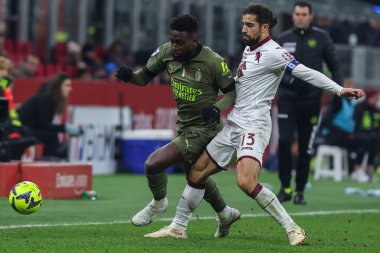Divock Origi of AC Milan competes for the ball with Ricardo Rodriguez of Torino FC during Serie A 2022/23 football match between AC Milan and Torino FC at San Siro Stadium, Milan, Italy on February 10, 2023 - Credit: Fabrizio Carabelli/LiveMedi