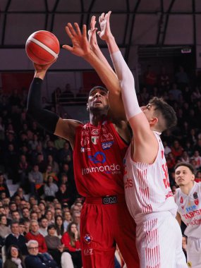 Brandon Davies (EA7 Emporio Armani Olimpia Milano) thwarted by Guglielmo Caruso (Pallacanestro Openjobmetis Varese)  during Italian Basketball A Serie  Championship Openjobmetis Varese vs EA7 Emporio Armani Milano at the Enerxenia Arena in Varese, It