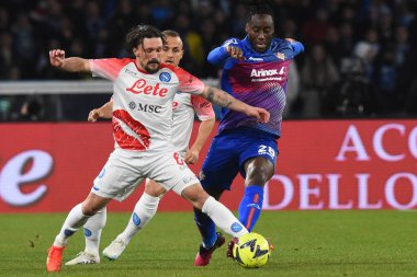 Mario Rui of SSC Napoli  competes for the ball with Soualhio Meitr of US Cremonese  during the Serie A match between SSC Napoli v Cremonese SC at Diego Armando Maradona  Stadium  - Credit: Agostino Gemito/LiveMedi