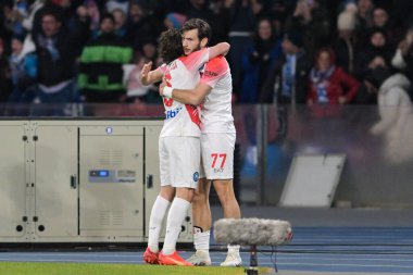Khvicha Kvaratskhelia (77) SSC Napoli 1926 celebrates after scoring a goal with Mario Rui (6) SSC Napoli 1926 during the Italian Serie A 2022/2023 football match between Napoli vs Cremonese on February 12, 2023 at the Stadium Maradona in Naples, Ital