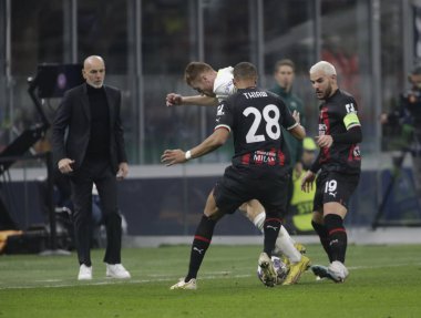 Dejan Kulusevsk of Tottenham Hotspur, Malick Thiaw of AC Milan and Theo Hernandez of AC Milan during the Uefa Champions League, football game between Ac Milan and Tottenham Hotspur on 14 February 2023 at San Siro Stadium, Milan, Italy. Photo Ndrerim 