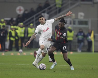 Rafael Leao of AC Milan and Cristian Romero of Tottenham Hotspur during the Uefa Champions League, football game between Ac Milan and Tottenham Hotspur on 14 February 2023 at San Siro Stadium, Milan, Italy. Photo Ndrerim Kaceli - Credit: Nderim Kacel