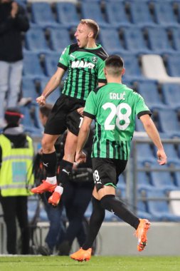 ABD 'li Davide Frattesi Sassuolo Calcio, 6 Mart 2023 tarihinde İtalya' nın Reggio Emilia kentinde Mapei Stadyumu-Citta del Tricolore 'da ABD' li Sassuolo Calcio ve ABD Cremonese arasında oynanan Serie A maçında gol attıktan sonra bunu kutluyor. - Fotoğraf: Luca Amedeo Bizzar