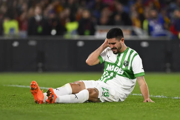 stock image Martin Erlic of U.S. Sassuolo lies down injured during the 26th day of the Serie A Championship between A.S. Roma vs U.S. Sassuolo on March 12, 2023 at the Stadio Olimpico, Rome, Italy. - Credit: Domenico Cippitelli/LiveMedi