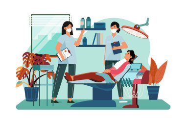 Diş hekimi, hastanın dişlerini kontrol ediyor..