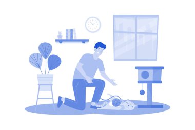 Hayvan sahipleri kızıl kediyle oynuyorlar.