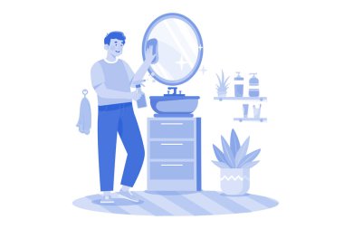 Man Cleaning Mirror In The Bathroom