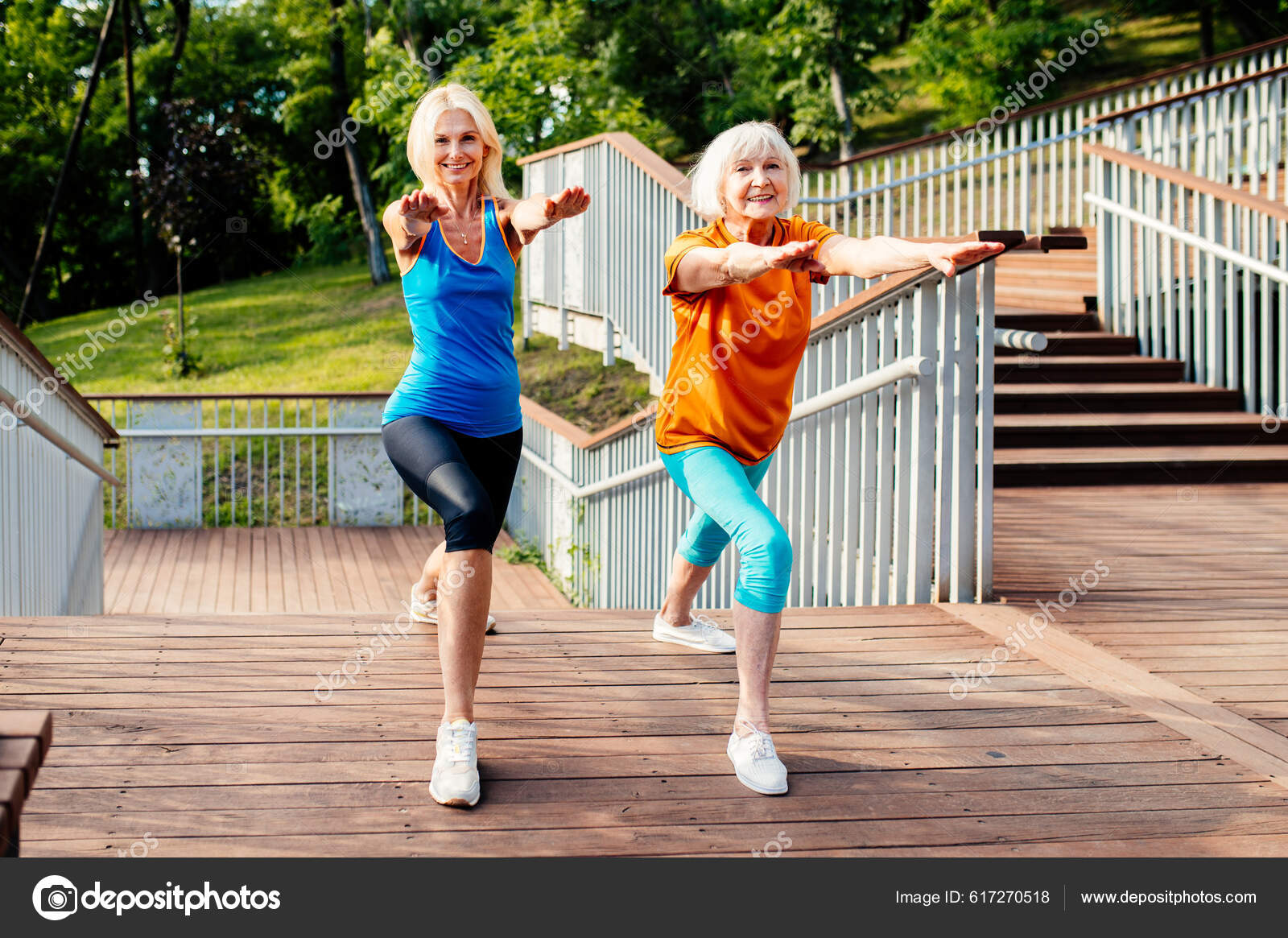 Beautiful Athletic Women Excercises In A Park Stock Photo, Picture