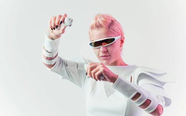 stock image Representation of a bionic super human with advanced technology parts as vr visors and gadgets playing in a mixed reality training room. Futuristic cyberpunk evolution of human mankind and AI