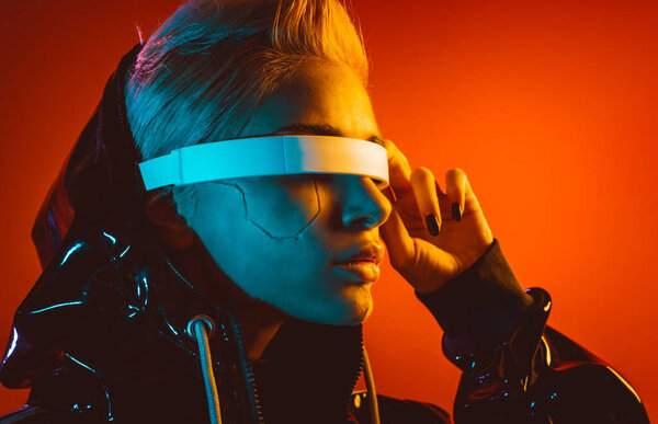 Representation of a bionic super human with advanced technology parts as vr visors and gadgets playing in a mixed reality training room. Futuristic cyberpunk evolution of human mankind and AI